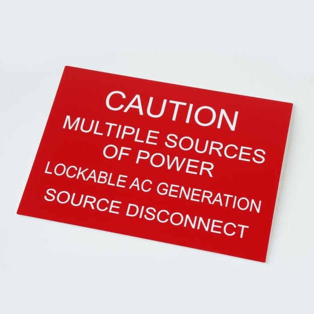 Red/white placard reading, "CAUTION MULTIPLE SOURCES OF POWER LOCKABLE AC GENERATION DISCONNECT"