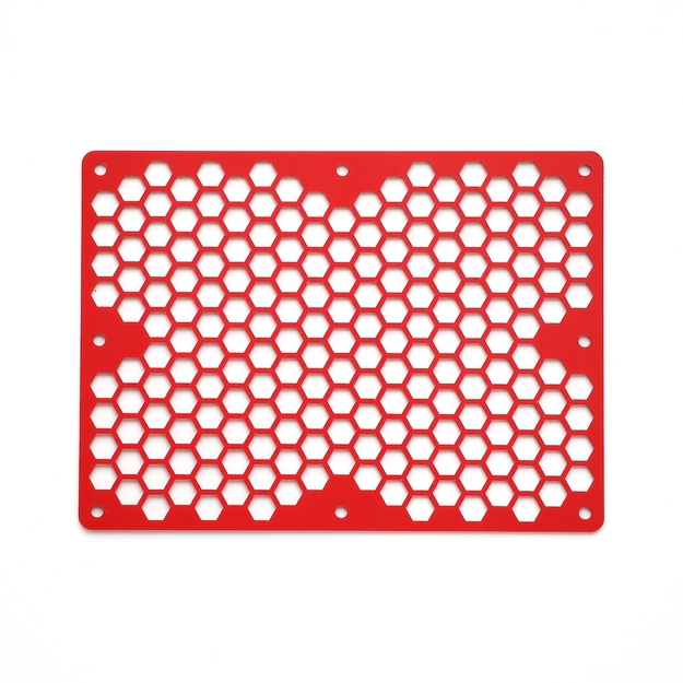 Red, rectangular panel arrayed with hexagonal holes and circular mounting holes around the perimeter