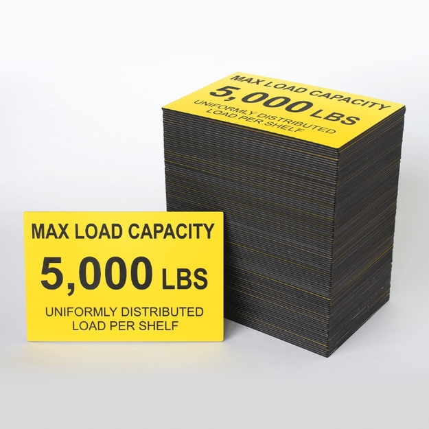 Stack of yellow/black placards with another leaning against it