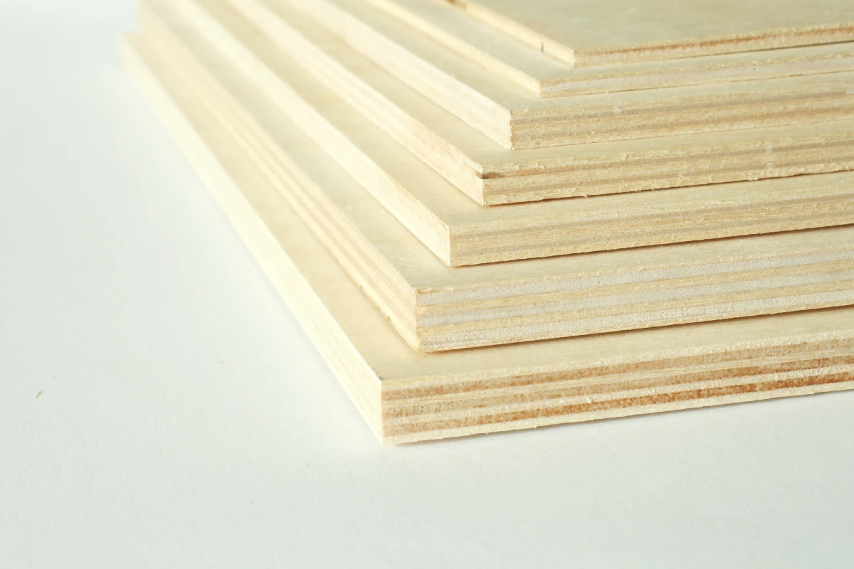 Corner view of a stepped stack of plywood sheets