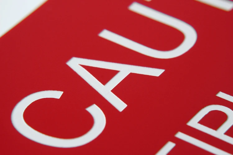 Closeup of laser-engraved text, exhibiting fine detail